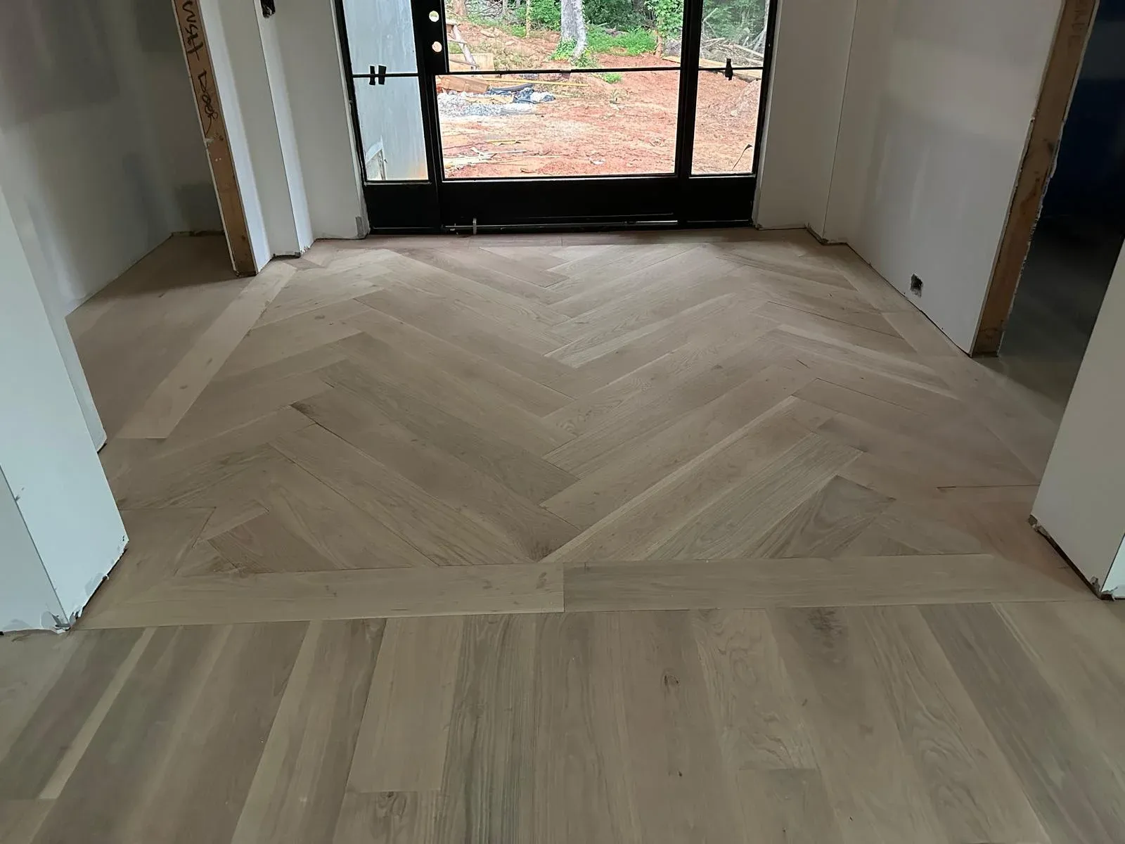 Light herringbone against black frames